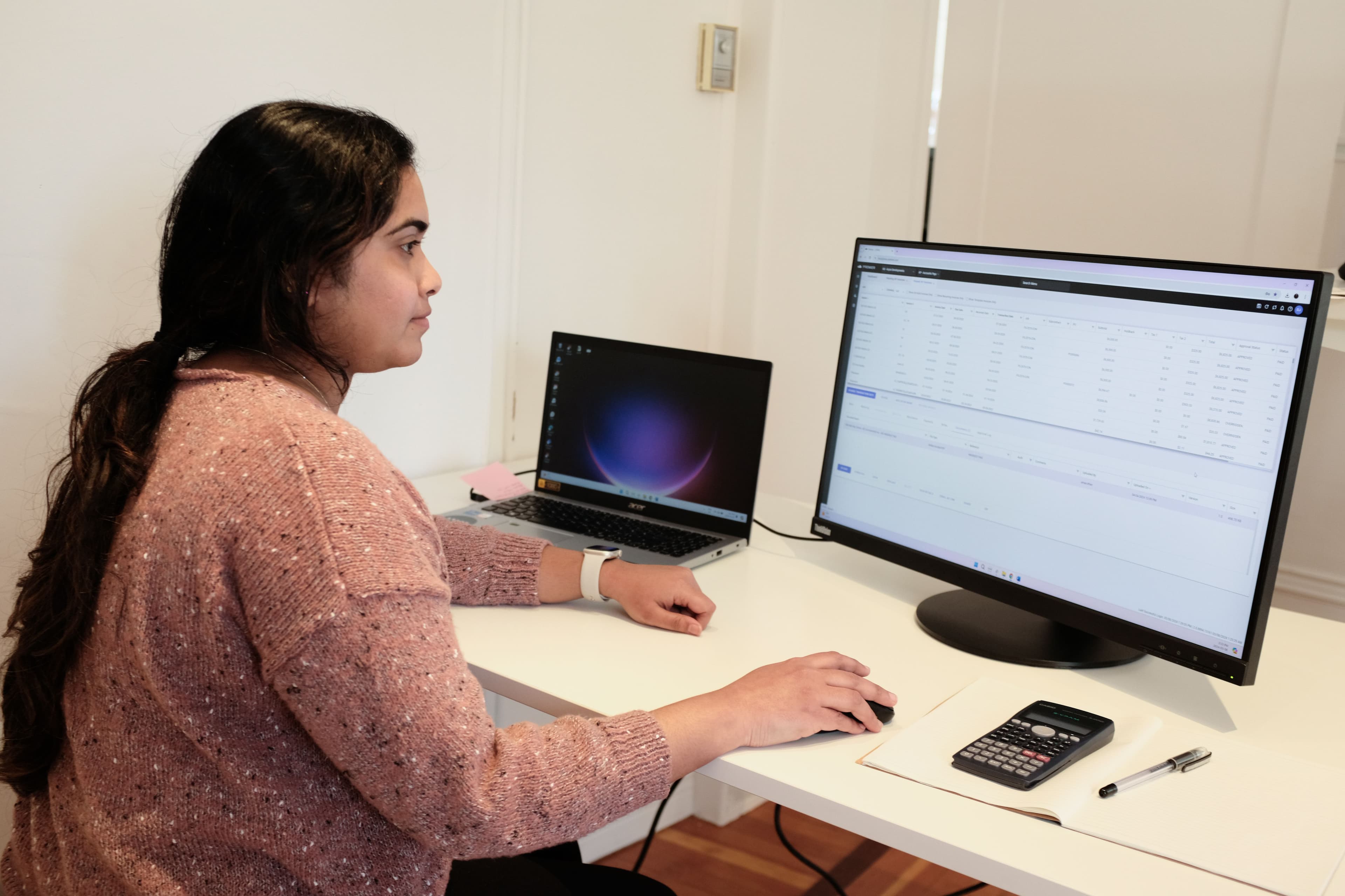 accountant woman sitting at a desk working