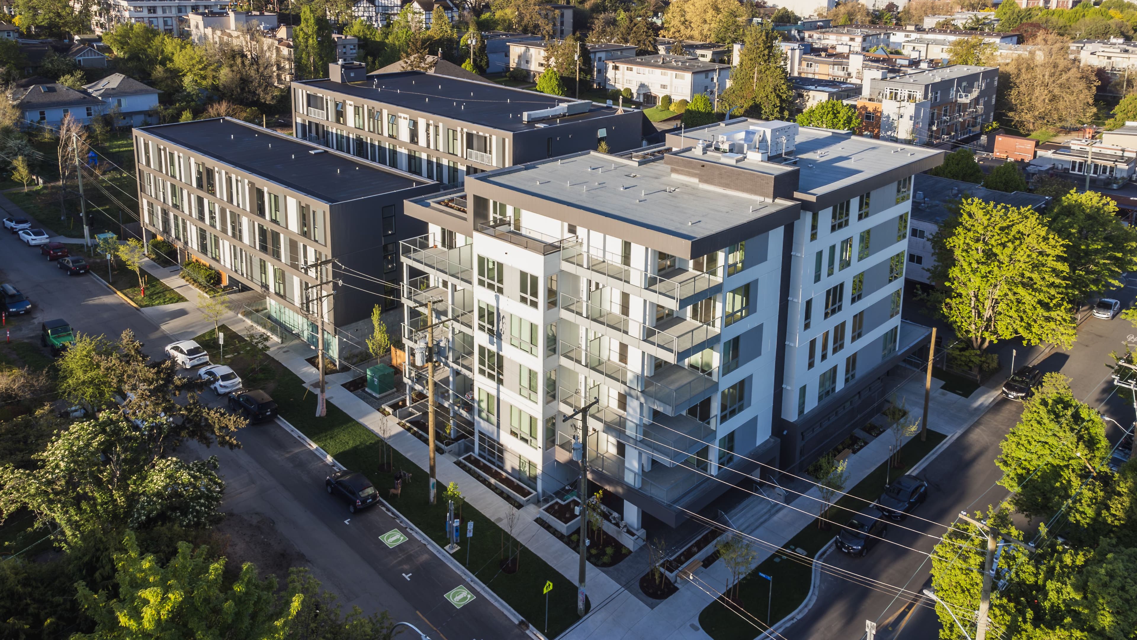 woman looking out bedroom window in Centro rental apartment